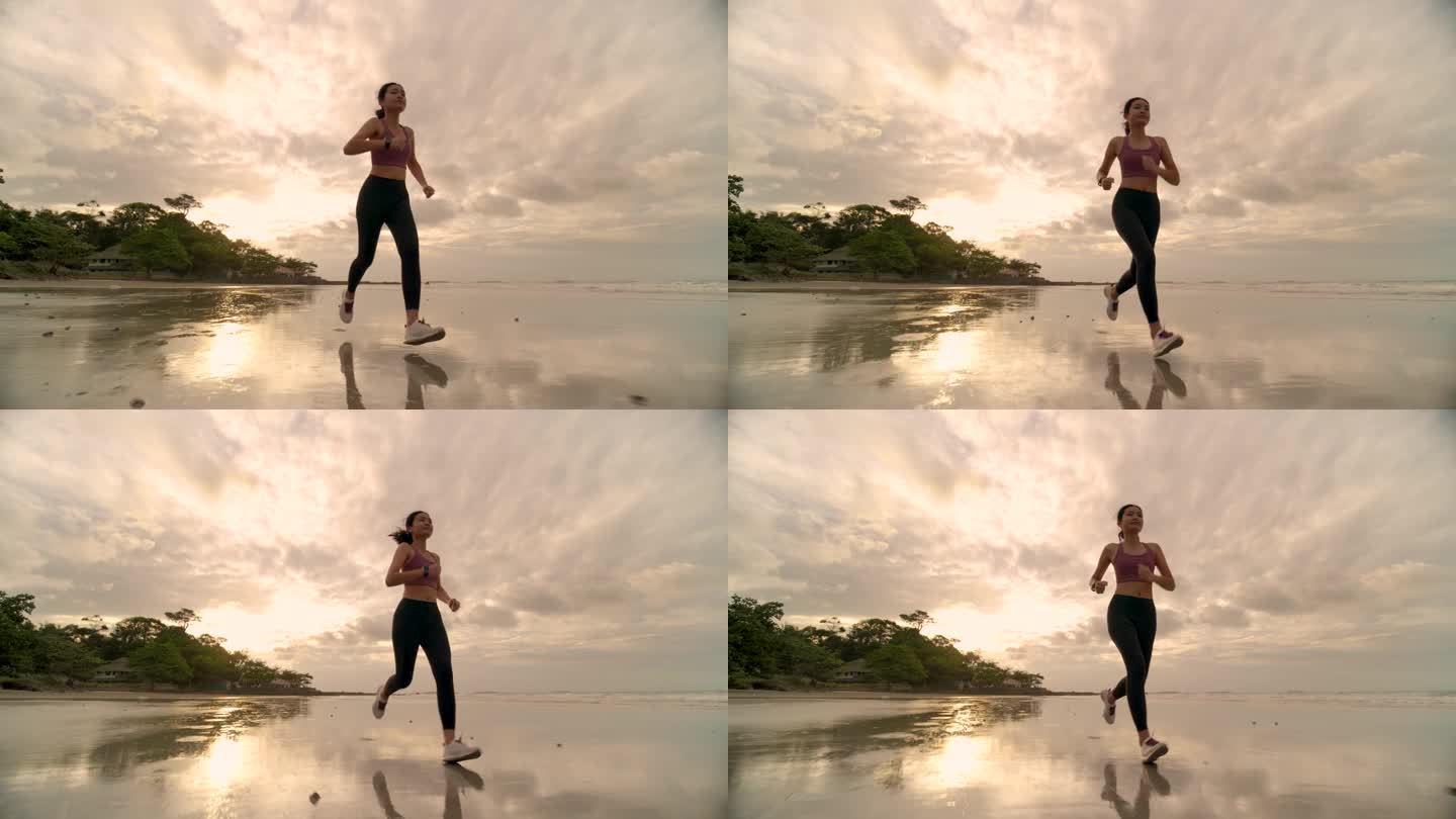 女人在沙滩上跑步女性健身晨跑美景沙滩