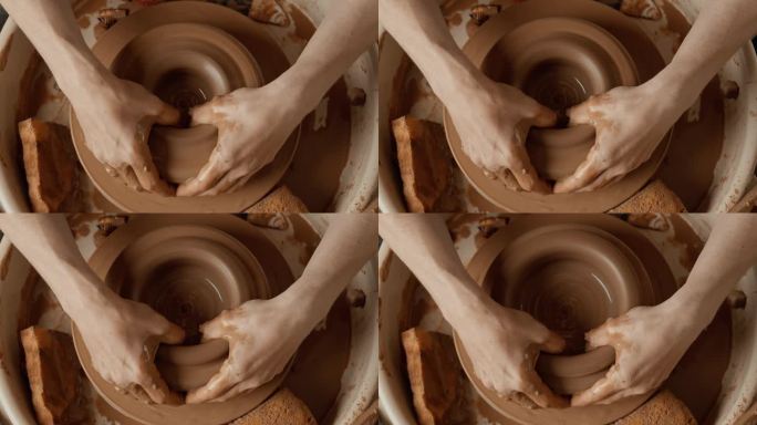 陶工在陶轮上制作陶瓷碗。前视图。陶土制品