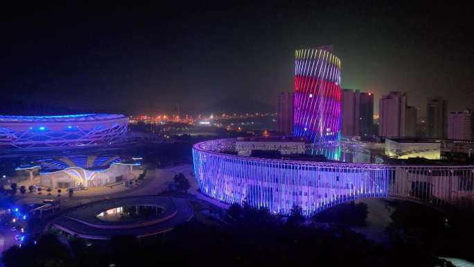 航拍枣庄市民服务中心广电大楼夜景榴花造型