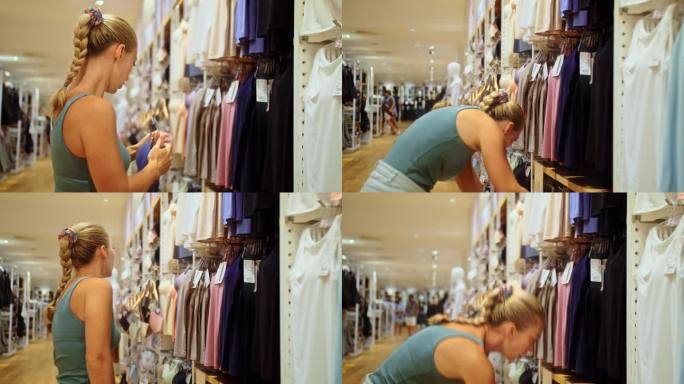 美女顾客在购物中心商店挑选运动服。满意的顾客顾客女孩购物者购买者购物狂在购物中心商店买打折衣服。在服