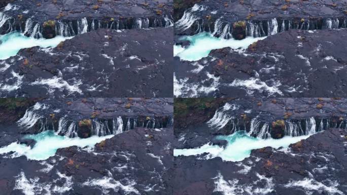航拍:布拉福斯瀑布(Brúarfoss)从冰岛南部的黄金圈倾泻而下的瀑布的侧面，风景如画，美丽的蓝色