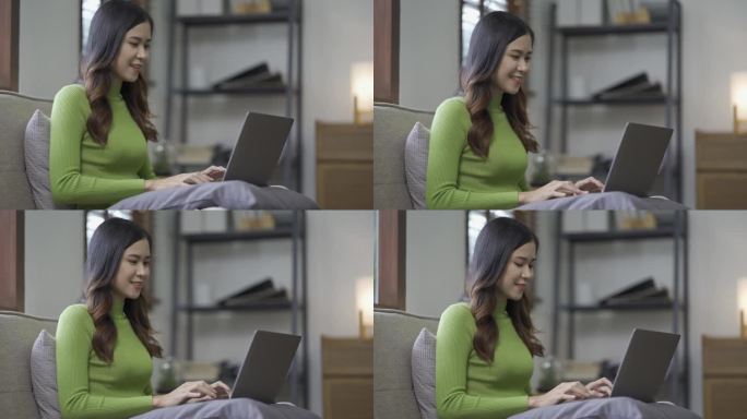 迷人的亚洲女性工作，上网，使用笔记本电脑设备，在家里的客厅地板上工作，表情开朗，快乐。