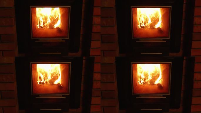 近距离静止视频的橙色热火焰火焰在壁炉。燃烧木块取暖效果最好。寒冷季节问题