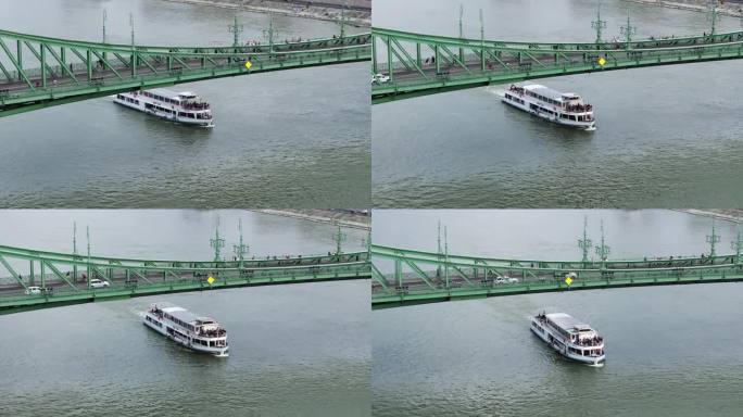 航拍幻灯片和全景照片，客船漂浮在历史悠久的桥下。在多瑙河上巡游。匈牙利布达佩斯
