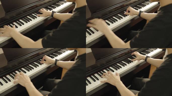 一个天才的钢琴演奏家在他的起居室里用钢琴练习音乐的高视角。