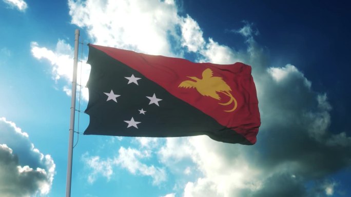 巴布亚新几内亚的国旗迎风飘扬在美丽的蓝天上