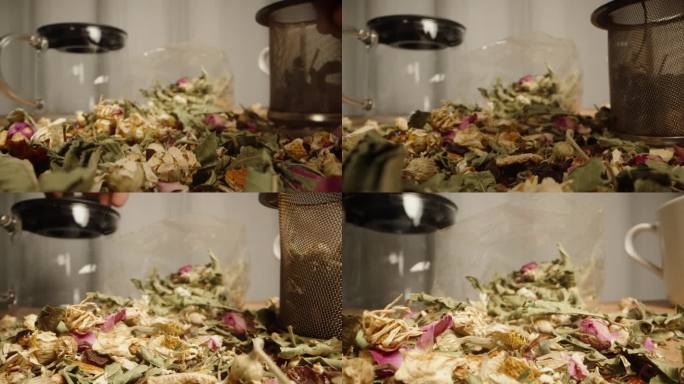 把茶叶和散落在桌子上的鲜花混合在一起，这是一种茶道。我在一个酿造筛子里放了一把。