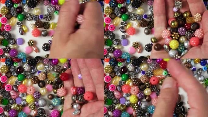 彩色的护身符，珠子手镯，项链或其他手工珠宝。4 k的视频