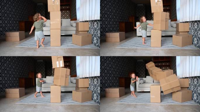 活泼的小孩把一堆纸板箱拿下来，慢动作镜头