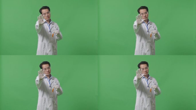亚洲男性科学家用橙色液体试管看着镜头，在实验室的绿色屏幕背景上没有手势表示不赞成