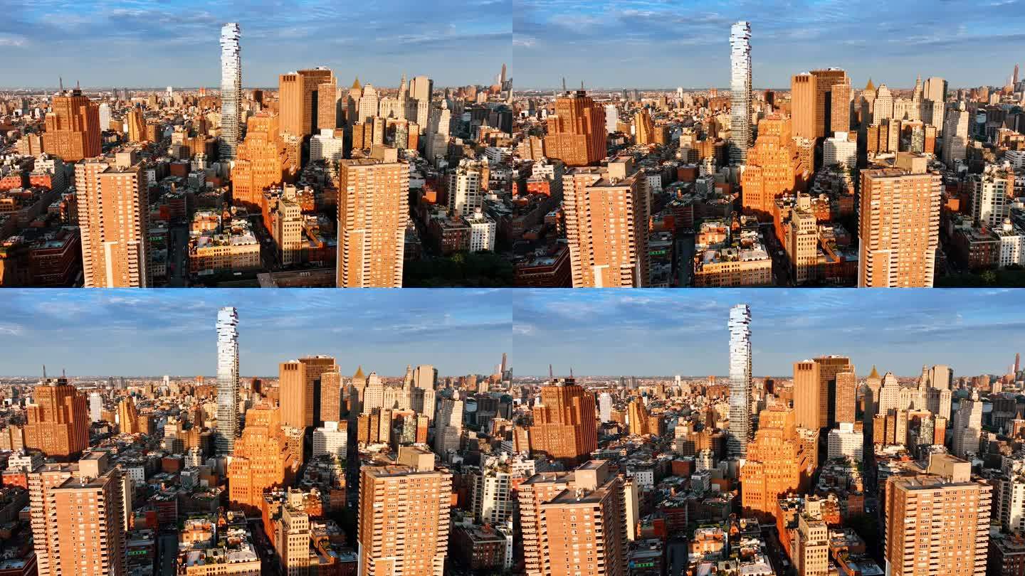 明亮的阳光照亮了纽约各种密集的建筑。无人机拍摄的黄金时段城市景观。