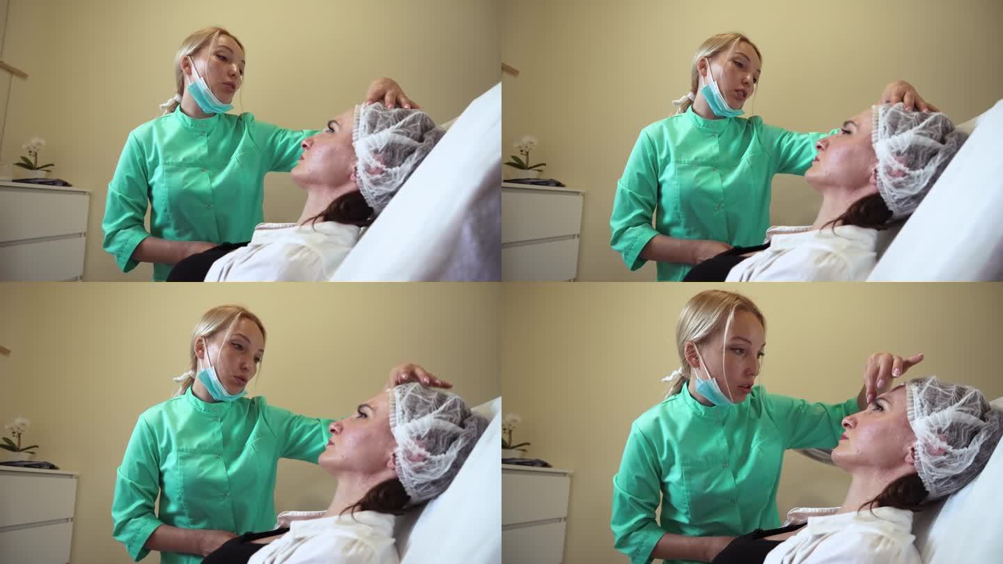 美容师在抗衰老神经毒素注射程序前在女性脸上做记号
