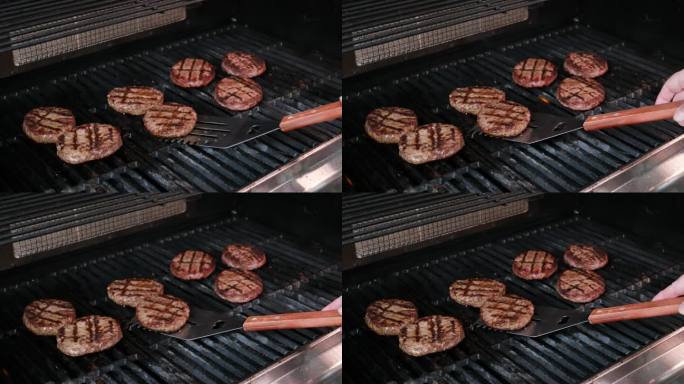 汉堡在燃烧的烤架上冷却，慢镜头。使用Phantom Flex 4K相机拍摄。