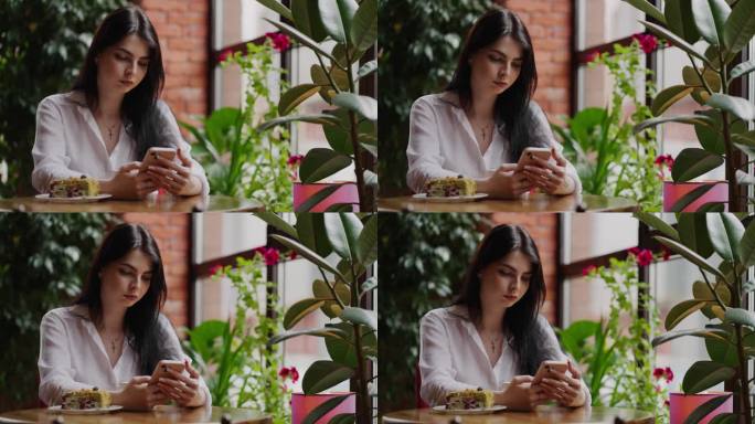 女商人白天在舒适的城市咖啡馆用餐，女士用智能手机上网
