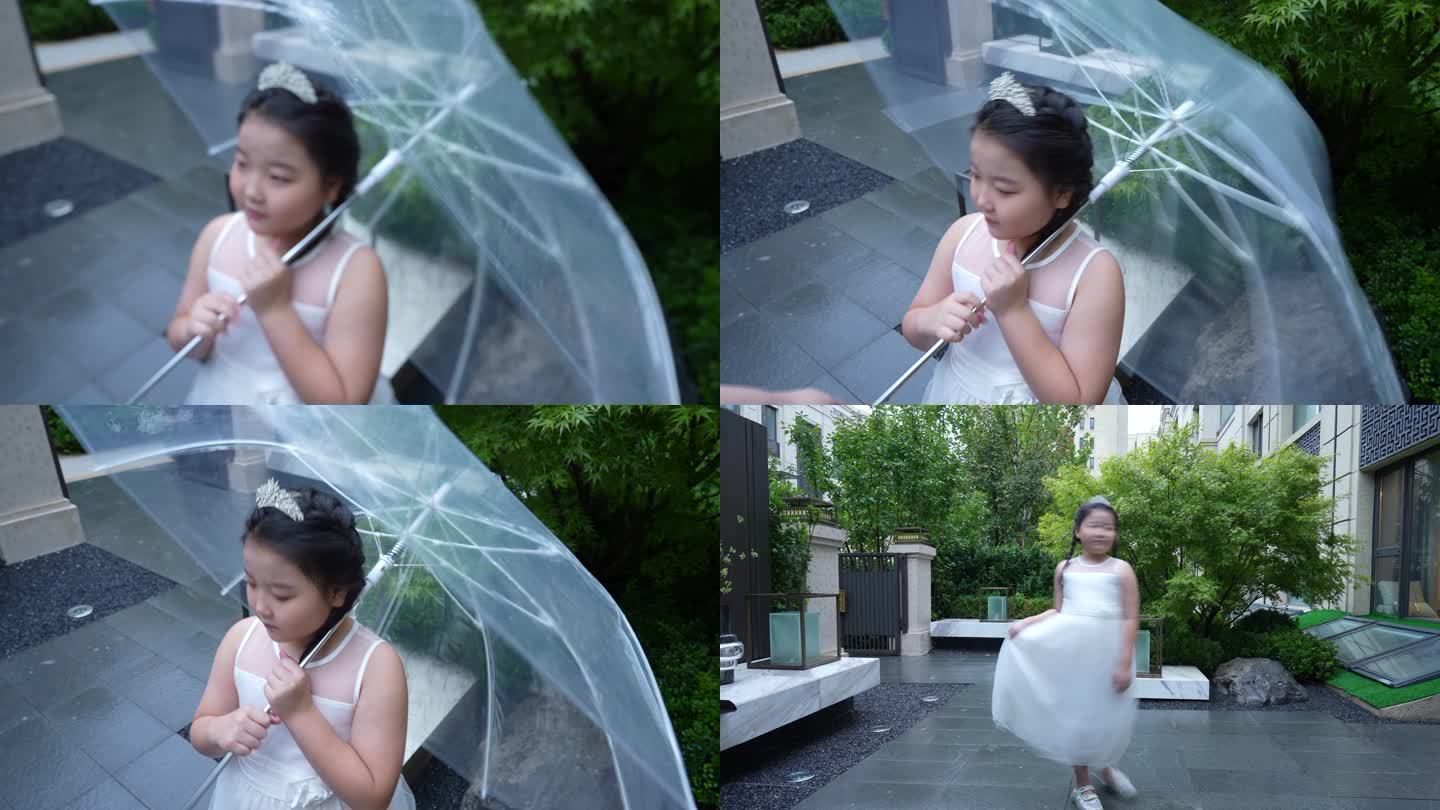 小女孩院子里撑伞玩耍