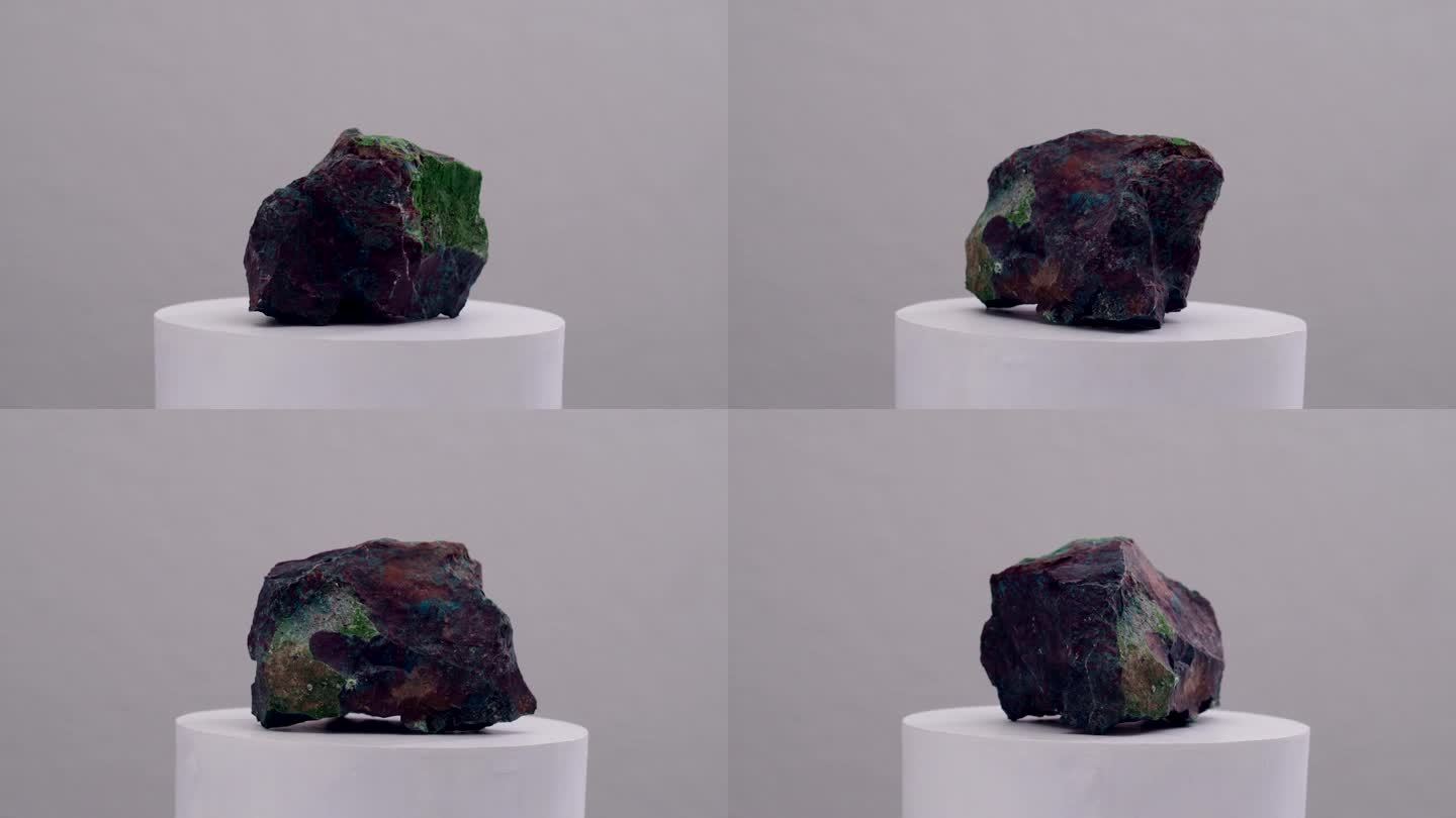 冥想仪式石蓝、绿和紫色的颜色旋转在一个白色的基座上显示浅背景的石英矿物
