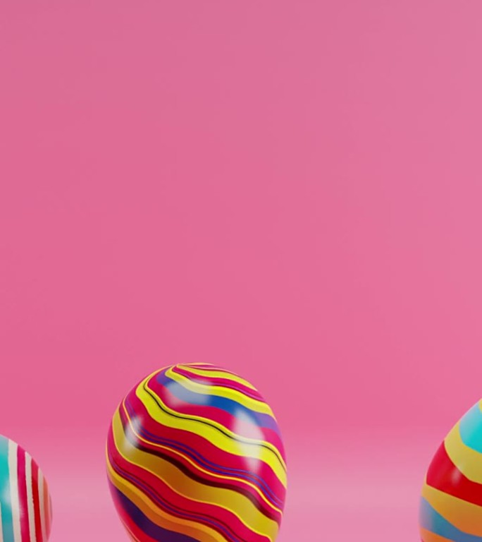 三个彩色条纹蛋在粉红色的背景与粉红色的背景。垂直循环动画