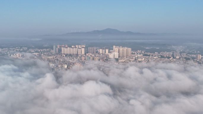 航拍延时视觉上升到流云面云下城市高楼