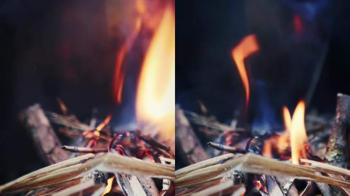 在炉子里烧木头。野营火炉。垂直视频