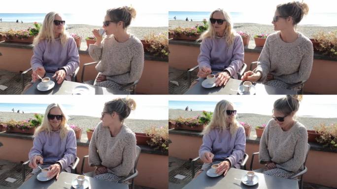 两个女人在海滨咖啡馆里聊天