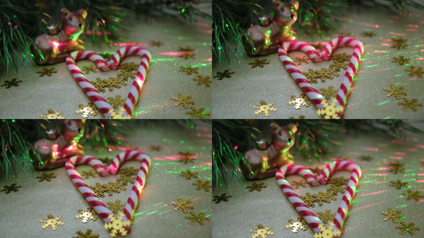 圣诞组成。甜甜的拐杖糖，金色的，银色的球玩具。圣诞家居装饰。大气的心情。新年快乐。闪耀的灯光