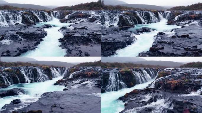 航拍:近距离俯瞰冰岛南部的布拉福斯瀑布(Brúarfoss)，从金色的圆圈上落下的瀑布非常风景如画，