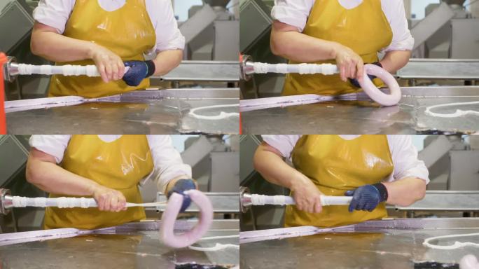 在肉制品厂，女工正在把香肠包装成天然肠衣。