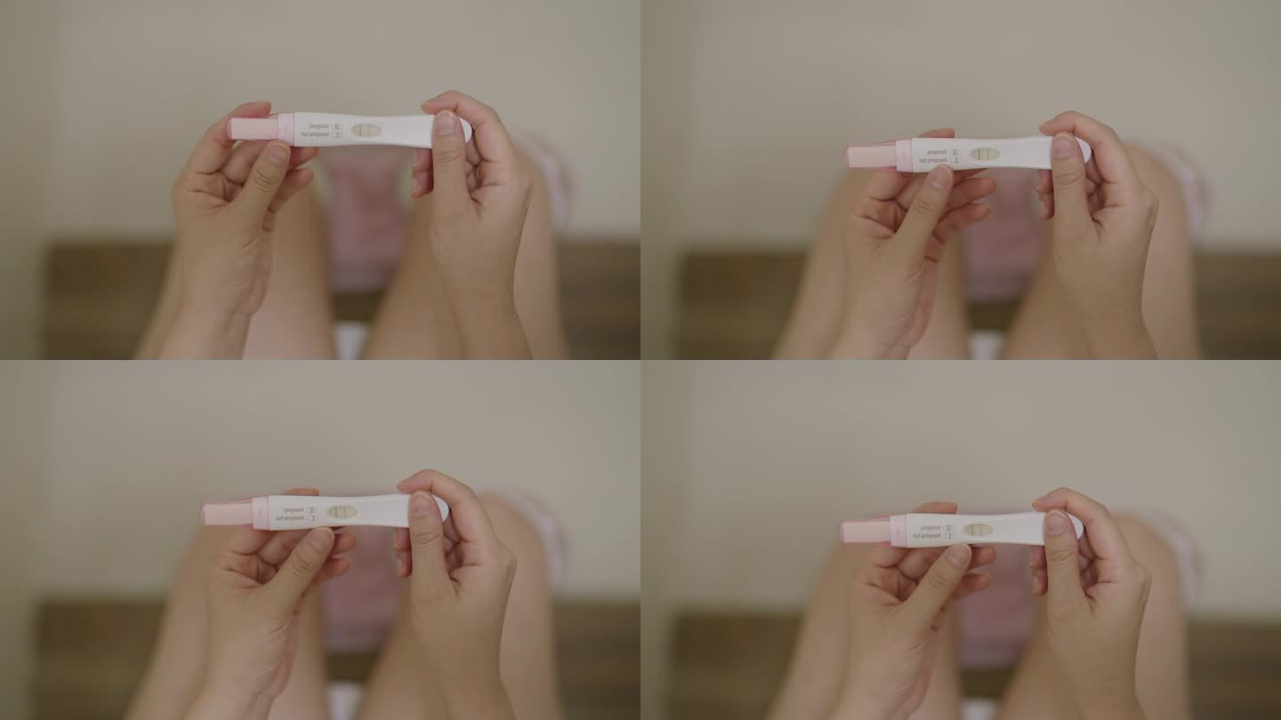 一名妇女在家里的浴室里做早孕测试