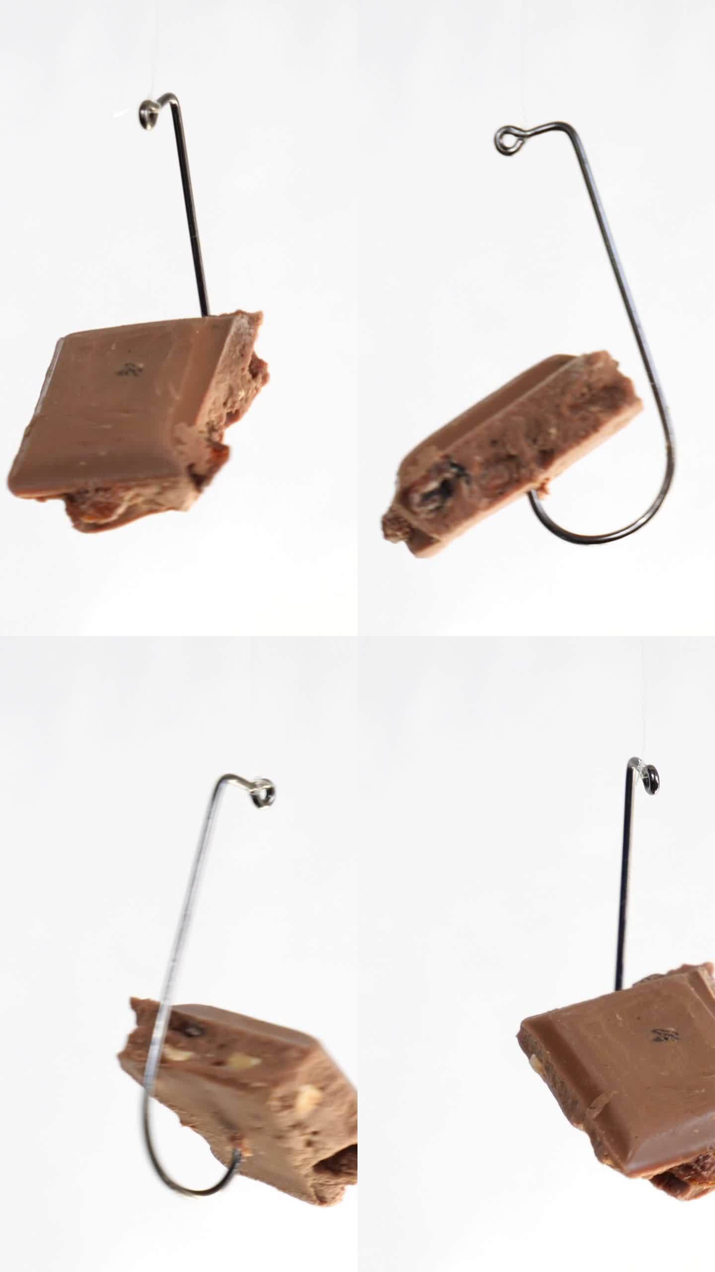 巧克力上的鱼钩孤立在白色背景垂直视频