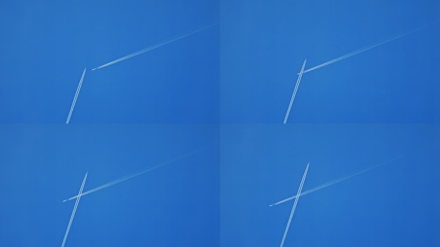 正下方的飞机相互交叉，在蓝色的天空中留下蒸汽痕迹