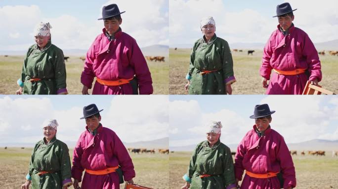 幸福的蒙古夫妇挤完牛奶走回蒙古包