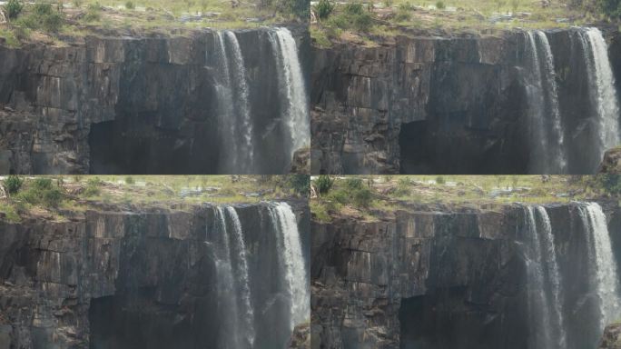 巨大的悬崖上有河流，这是赞比亚维多利亚瀑布的一部分