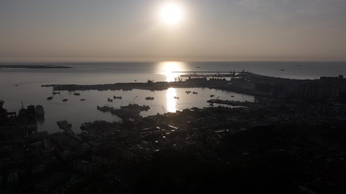 航拍日出晨光中的威海石岛渔港黄海造船厂