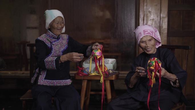 老人制作绣球手工缝制穿针引线穿透工艺民族