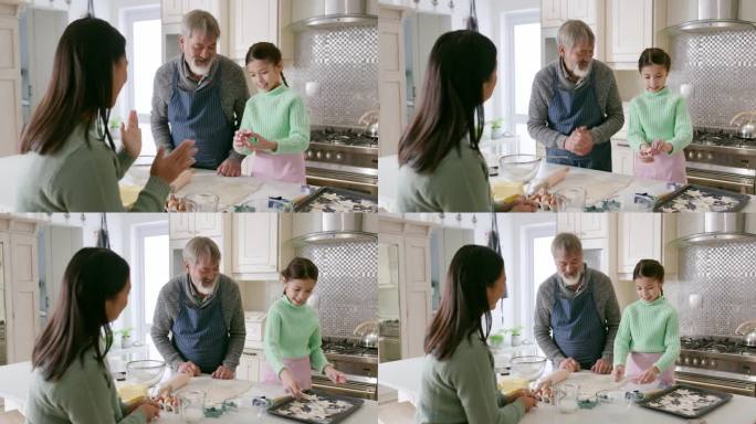 家庭，孩子和在厨房烘焙的纽带，关系和美好的时光在一起的童年记忆。亚洲人对制作饼干、甜点或点心的技巧报