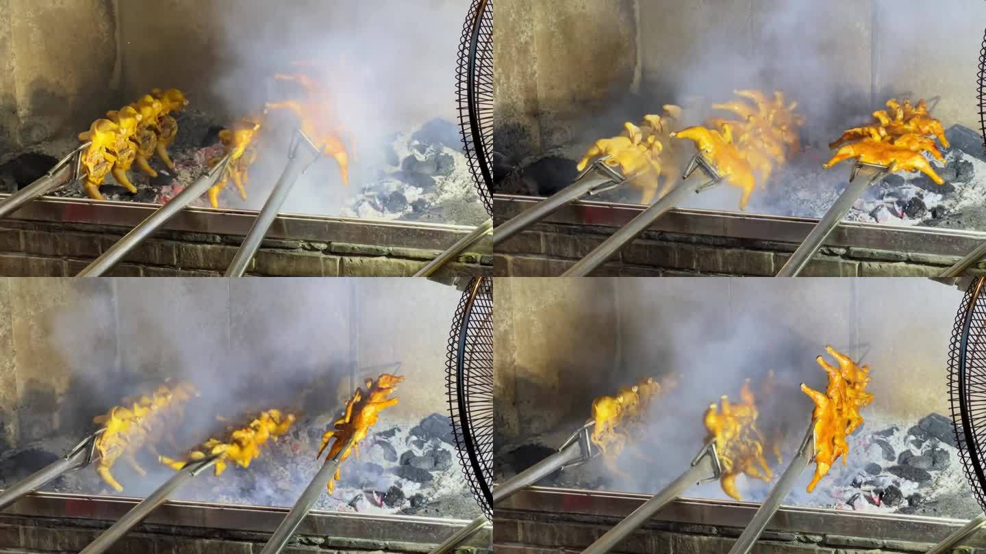 烧烤店的厨师用炭火烤整只鸡，炭烤鸡