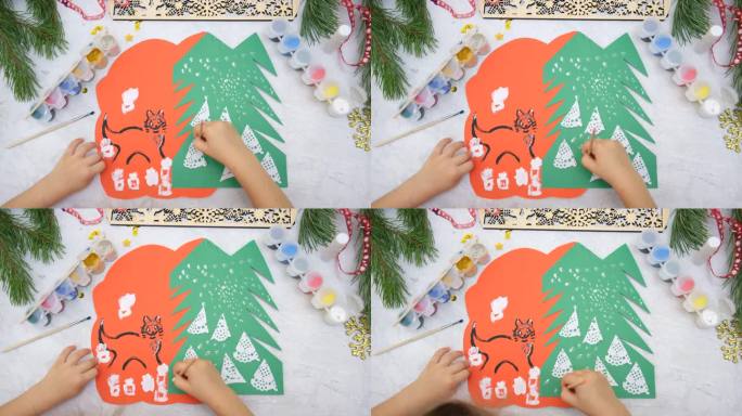 孩子为孩子们制作贺卡工艺。漂亮的贺卡，圣诞雪林。