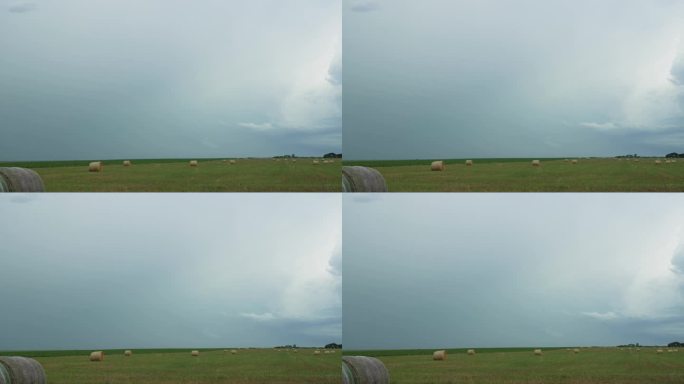 堪萨斯州农场里的干草捆和远处的雷雨