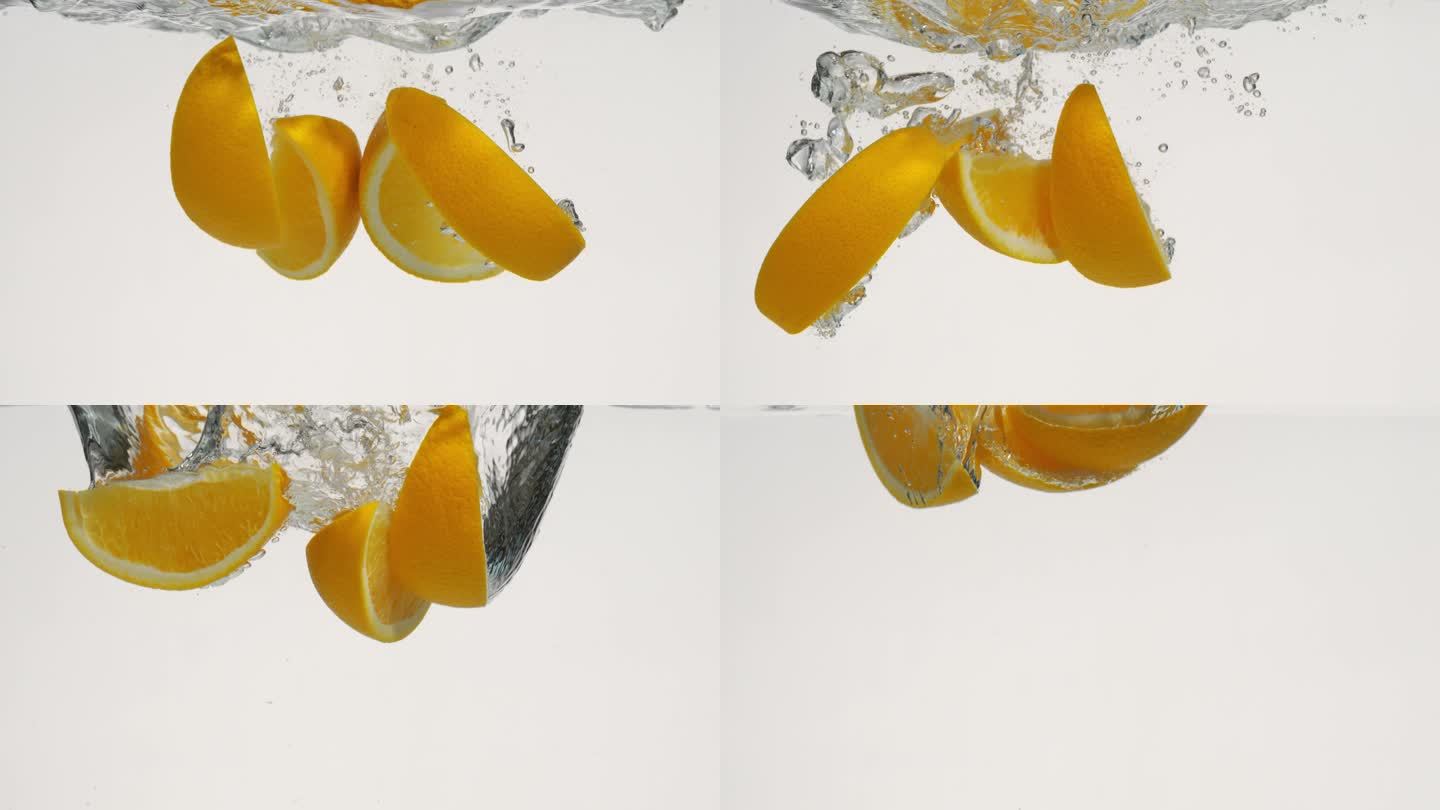 橙子切角落入水中慢镜头合集