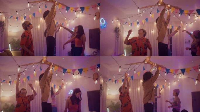 一群亚洲朋友计划在晚上用灯装饰房间来开派对。