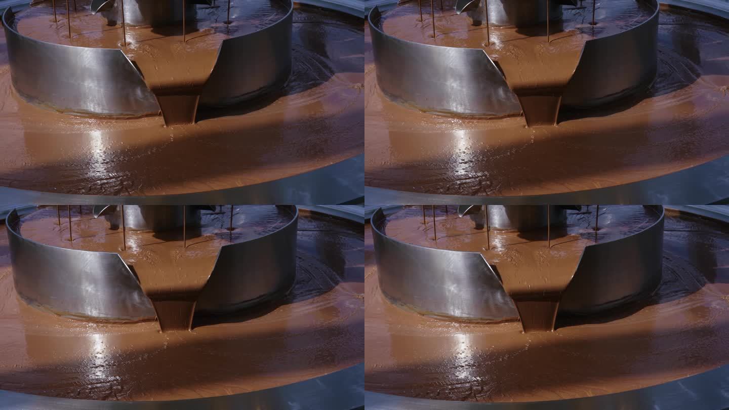 热牛奶融化的巧克力倒在喷泉上，特写，慢镜头。