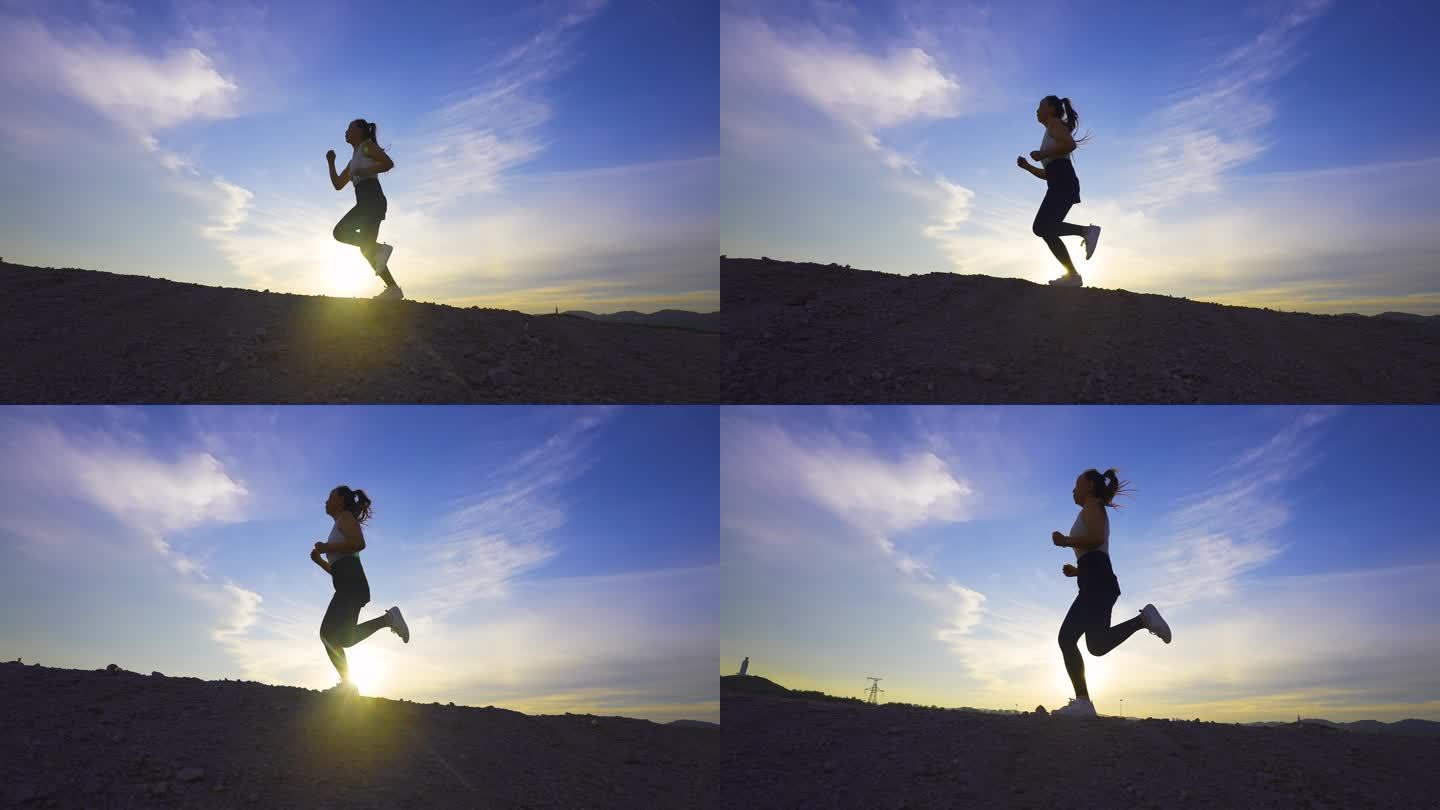 跑步奔跑女孩逆光锻炼身体健康阳光自由户外