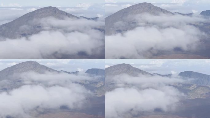 在夏威夷毛伊岛的哈雷阿卡拉山顶，厚厚的云层覆盖着火山口，这是电影般的特写镜头。30fps的4K HD