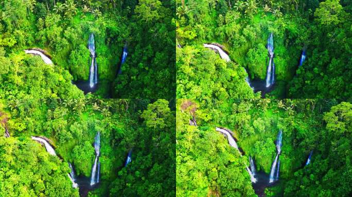 斐济瀑布在巴厘岛郁郁葱葱的雨林中倾泻而下，汇入泻湖。