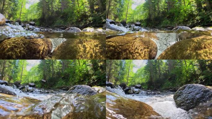 在清澈的山河中，镜头在石头之间移动。森林中山涧的半水下慢动作镜头。树林里有一条小河，有瀑布