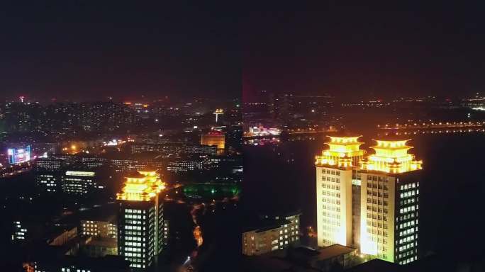 中南民族大学图书馆双子楼夜景航拍竖屏