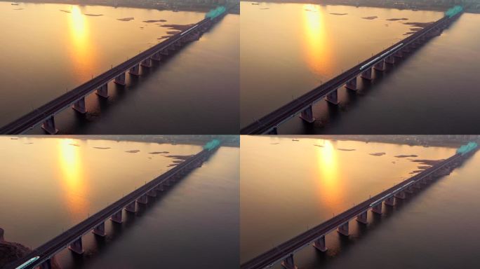 黄昏日落高铁驶过城市跨江大桥
