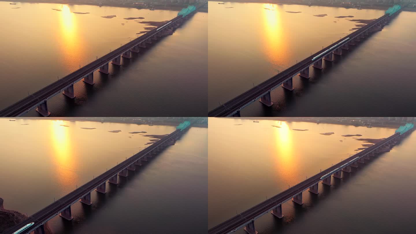 黄昏日落高铁驶过城市跨江大桥