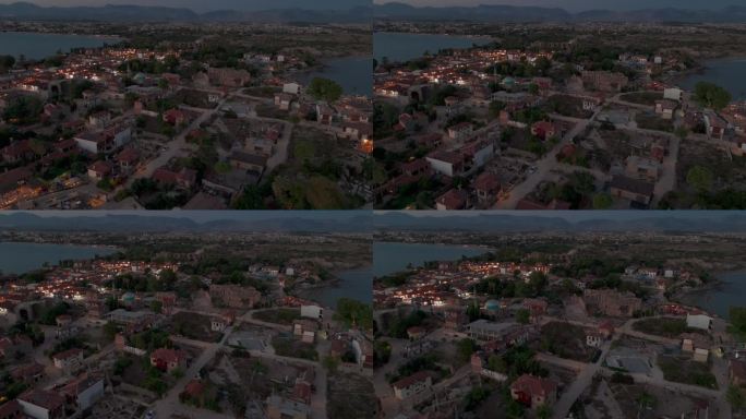 鸟瞰图飞过边老城土耳其邻里住宅和开发房地产在日落