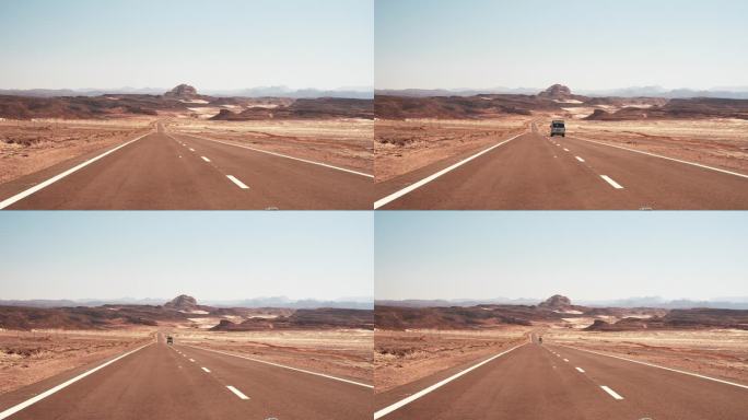 小巴驶过空旷的柏油路，驶进远方荒蛮的沙漠。在炎热的天气自驾游